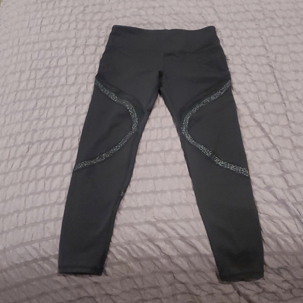 Zyia leggings, size 6-8, black with snakeskin print mesh.